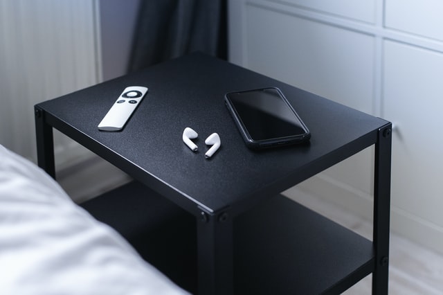 gadgets on bedside table