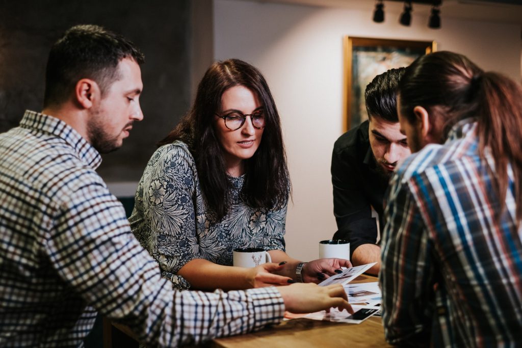 group of people talking together and brainstorming