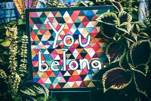 colorful sign reads you belong
