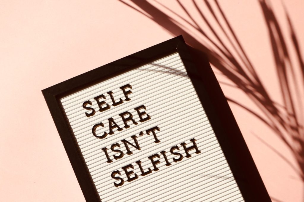 framed board with self care isn't selfish text